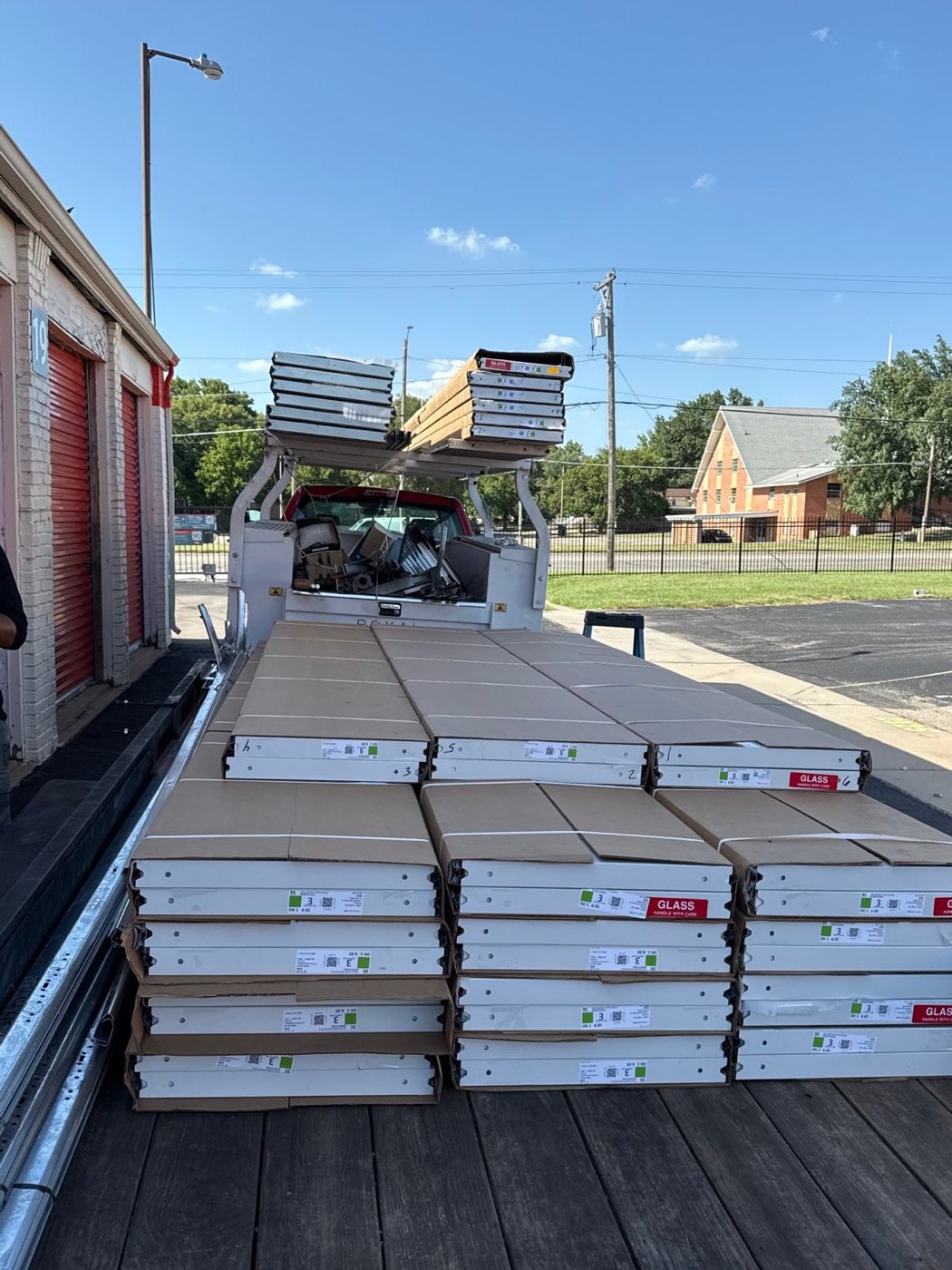 Supreme Door work truck loaded with new garage door panels