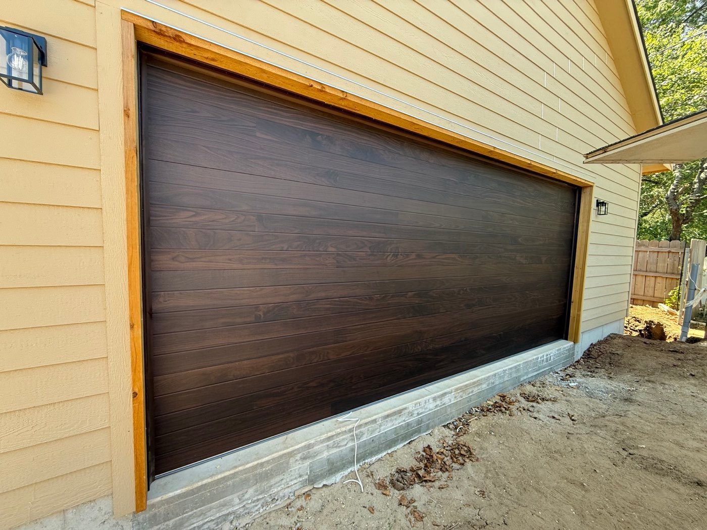 Dark walnut flush-panel garage door